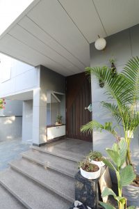 Outdoor area combining modern landscaping with traditional design elements.